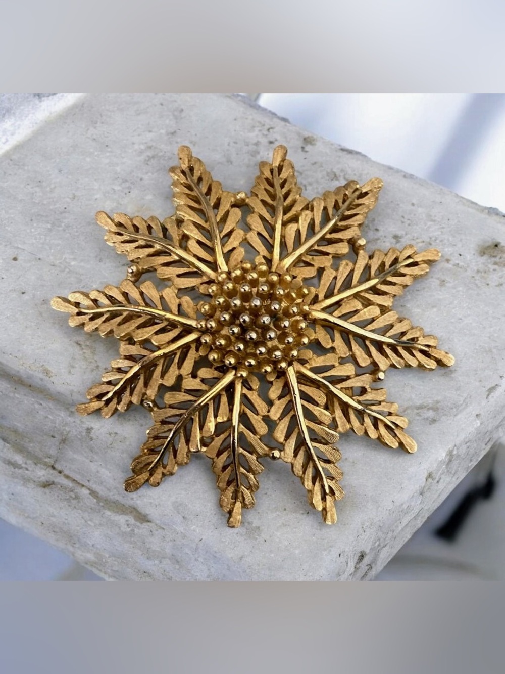 Vintage crown Trifari brushed goldtone flower brooch